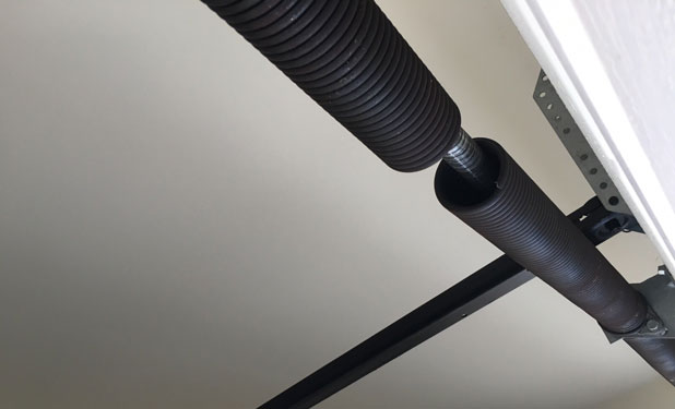 Broken garage door torsion spring Monroe County